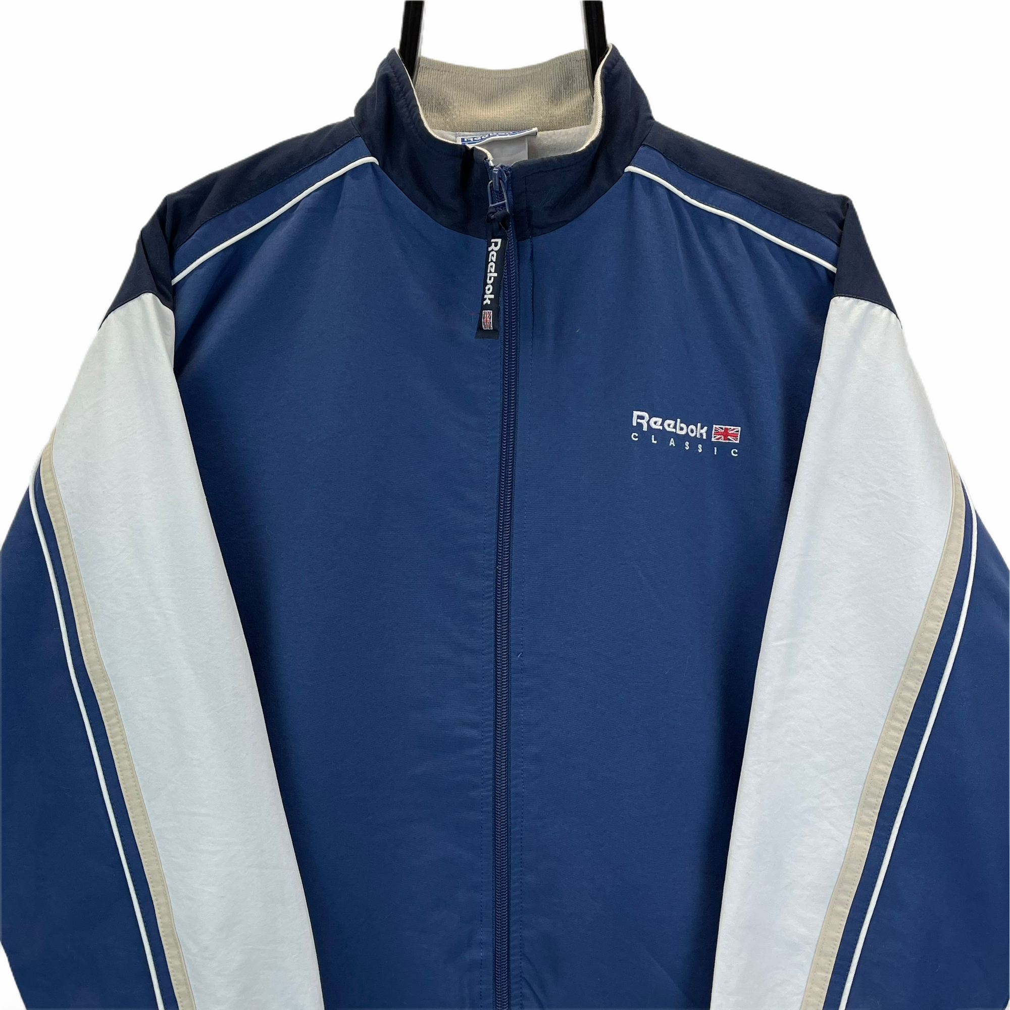 VINTAGE 90S REEBOK SPELLOUT TRACK JACKET IN NAVY, BEIGE & WHITE - MEN'S SMALL/WOMEN'S MEDIUM