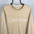 Calvin Klein Spellout Sweatshirt in Beige - Men's Large/Women's XL