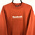 Vintage 90s Reebok Spellout Sweatshirt in Orange - Men's Medium/Women's Large