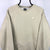 Vintage Nike Small Spellout Sweatshirt in Beige - Men's Medium/Women's Large