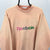 Vintage 80s Reebok Spellout Sweatshirt in Peach - Men's Medium/Women's Large