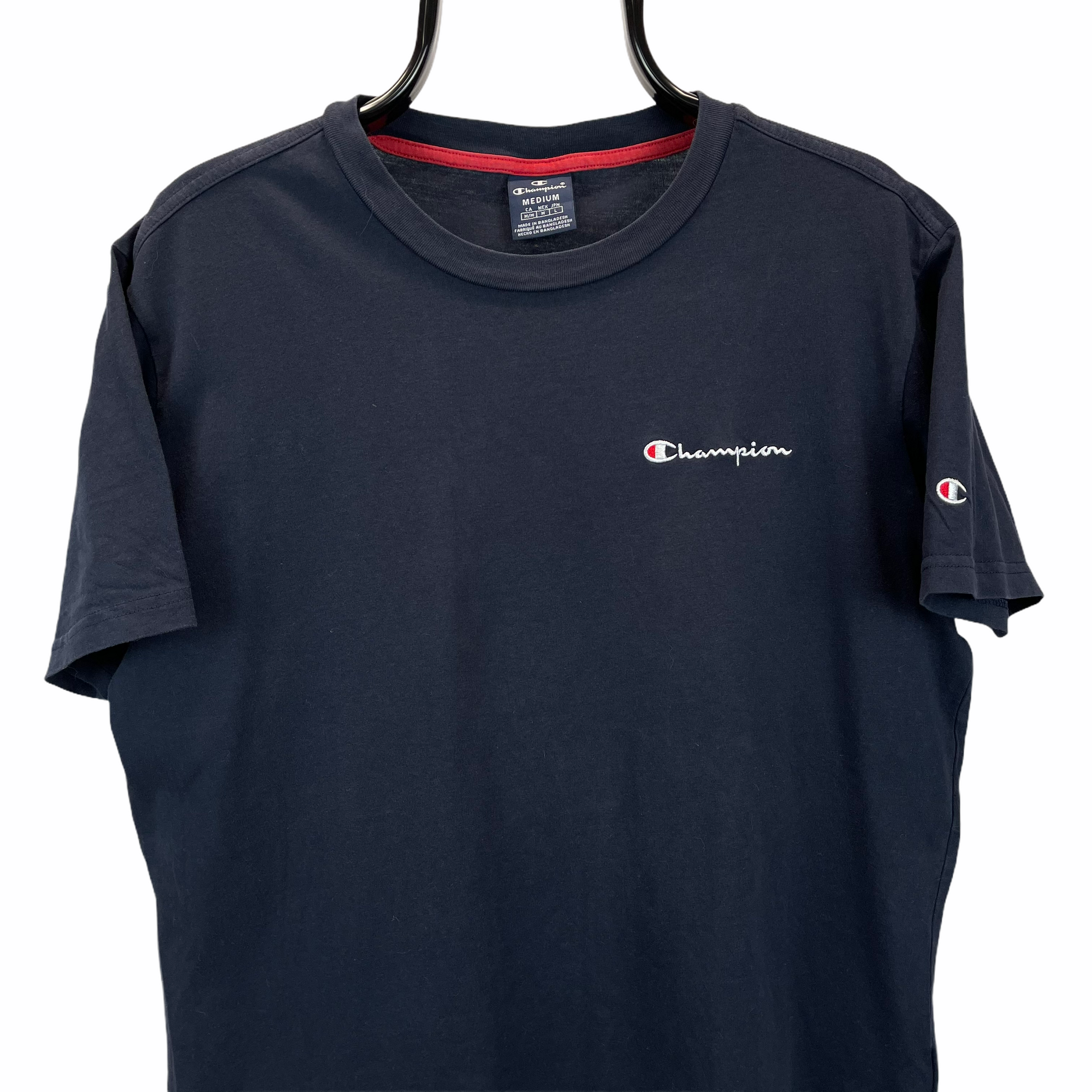CHAMPION EMBROIDERED SMALL SPELLOUT TEE IN NAVY - MEN'S MEDIUM/WOMEN'S LARGE