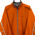 VINTAGE NIKE EMBROIDERED SWOOSH JACKET IN BURNT ORANGE - MEN'S LARGE/WOMEN'S XL