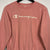 VINTAGE CHAMPION SPELLOUT SWEATSHIRT IN BABY PINK - WOMEN’S SMALL