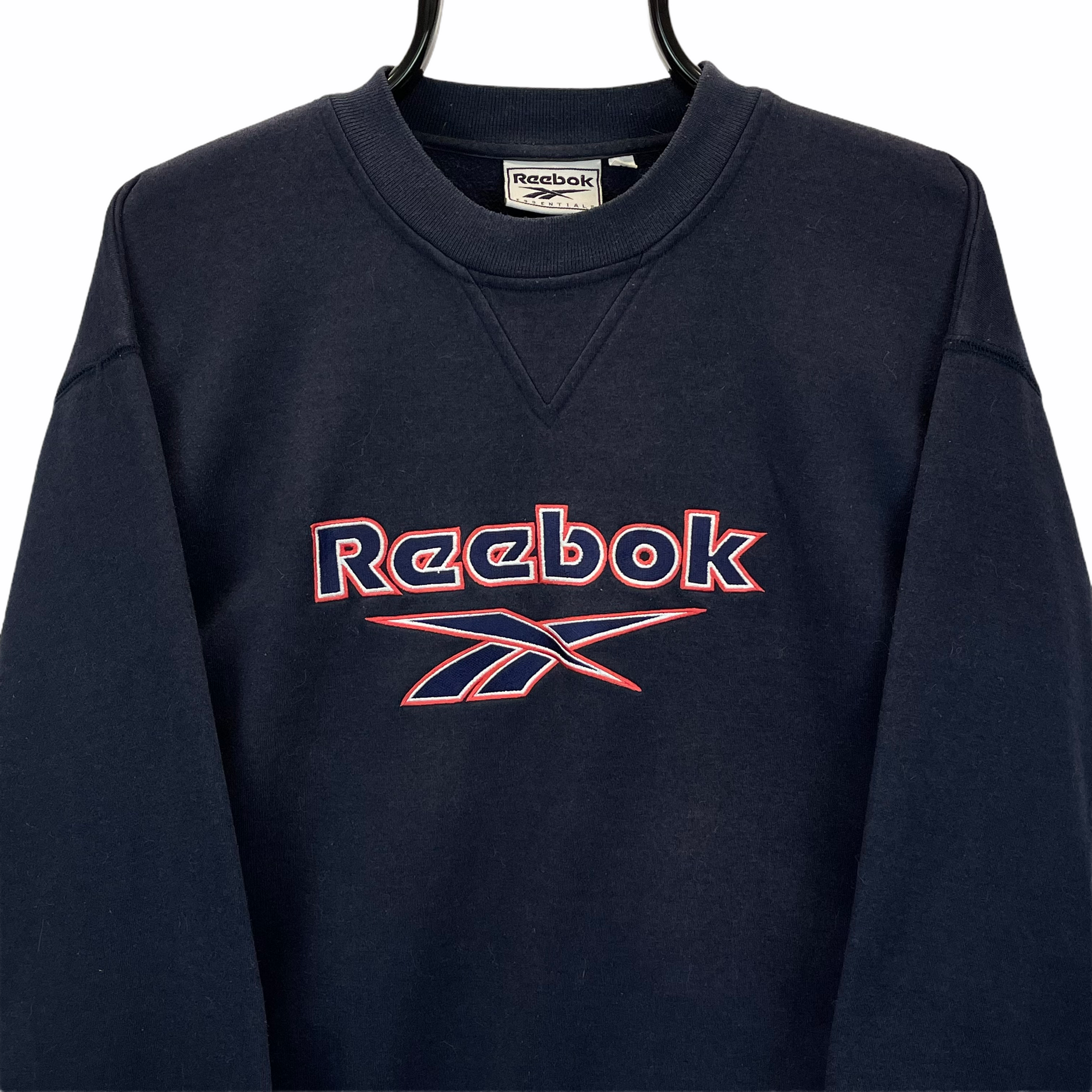 VINTAGE 90S REEBOK SPELLOUT SWEATSHIRT IN NAVY - MEN'S MEDIUM/WOMEN'S LARGE