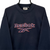 VINTAGE 90S REEBOK SPELLOUT SWEATSHIRT IN NAVY - MEN'S MEDIUM/WOMEN'S LARGE