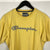 Vintage Champion Embroidered Spellout Tee in Yellow - Men’s Medium/Women’s Large